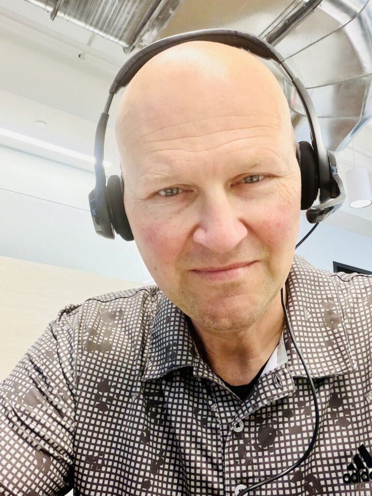 Matt Mitchell in a headset at the Life Insurance Academy telesales bootcamp